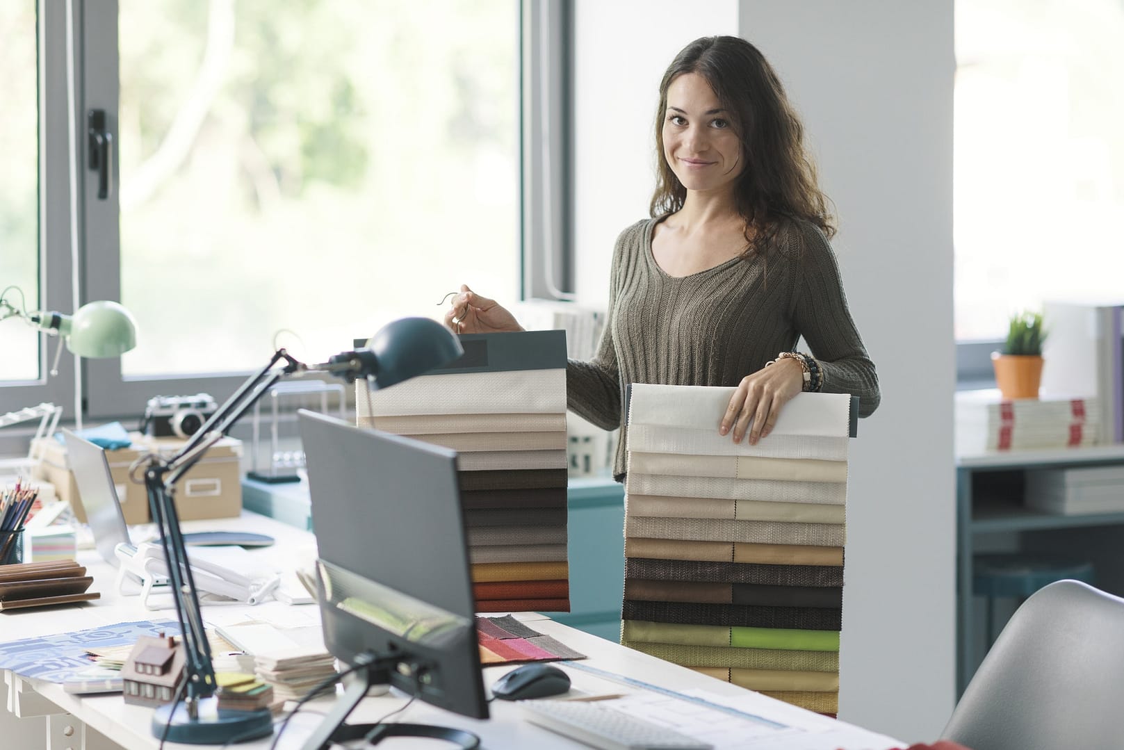 Interior designer holding fabric swatches