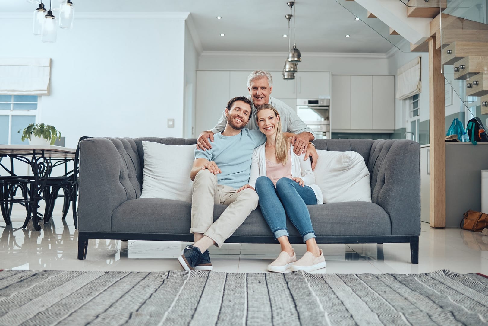 Couple portrait, sofa and senior father in family home with smile, happy bonding or holiday with hu