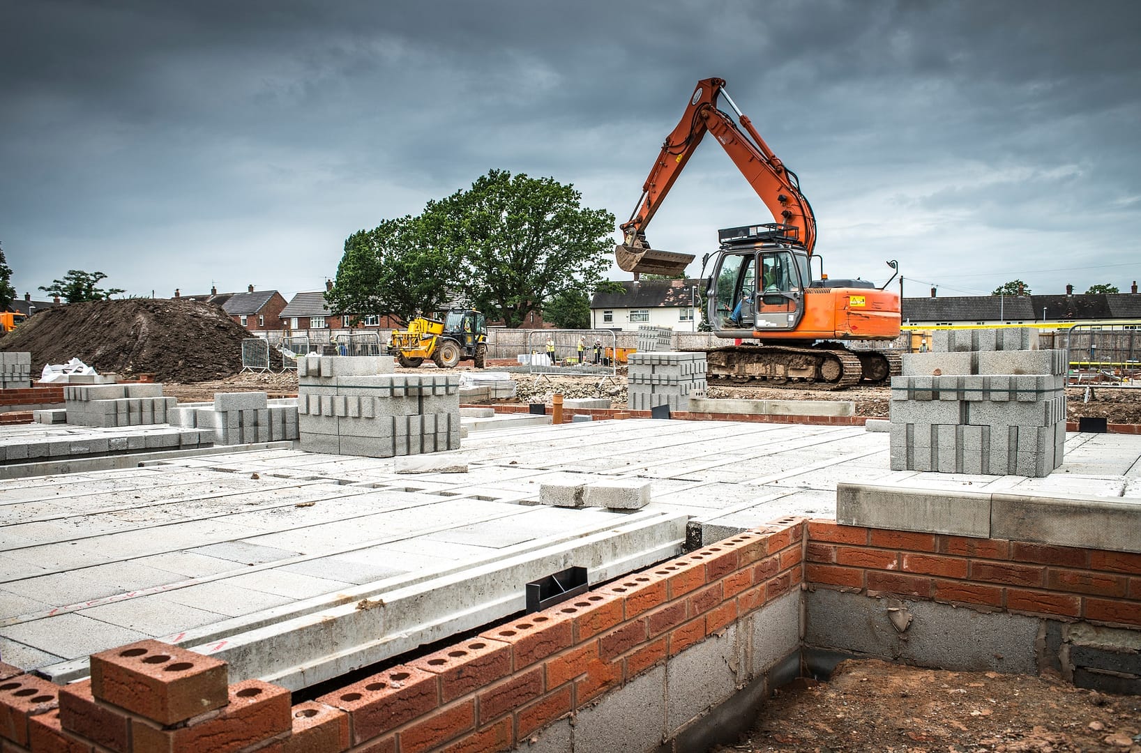 Tractor, building materials on construction site