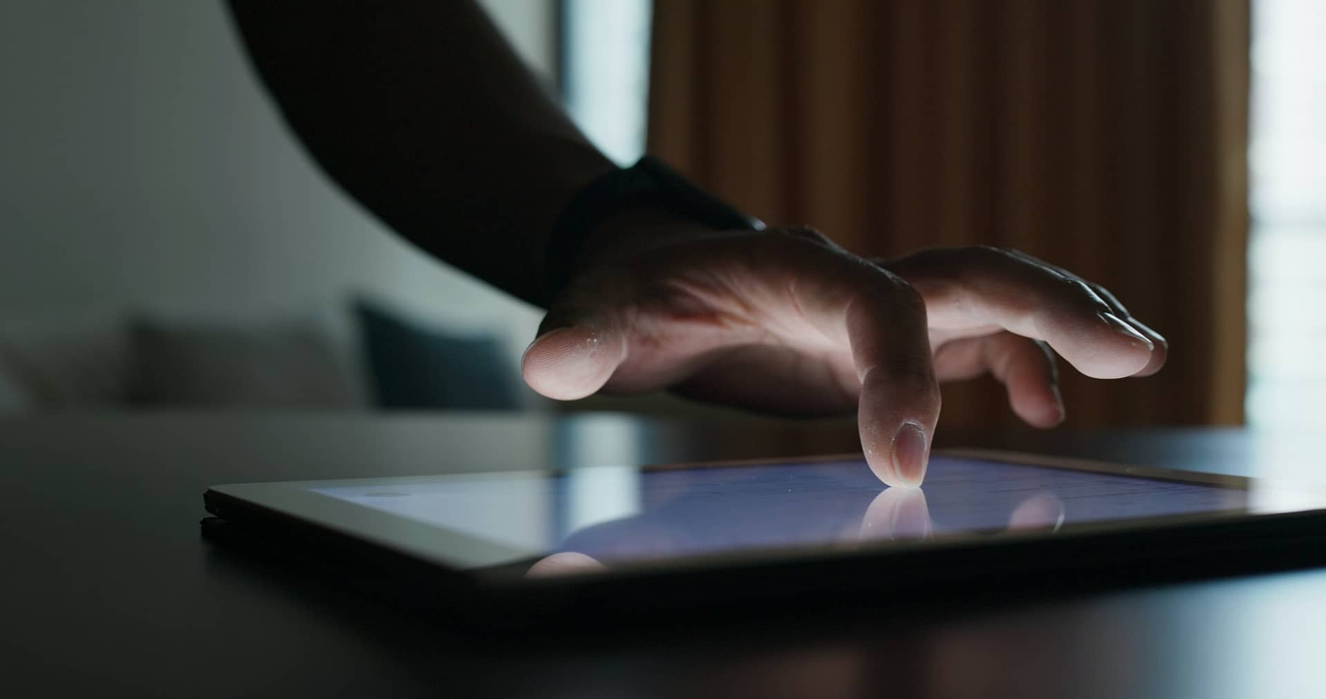 Woman use of tablet computer at home